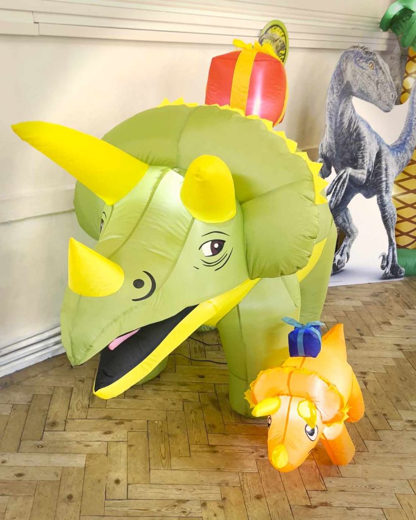 Inflatable triceratops party decorations at a children’s dinosaur birthday party near Camberley
