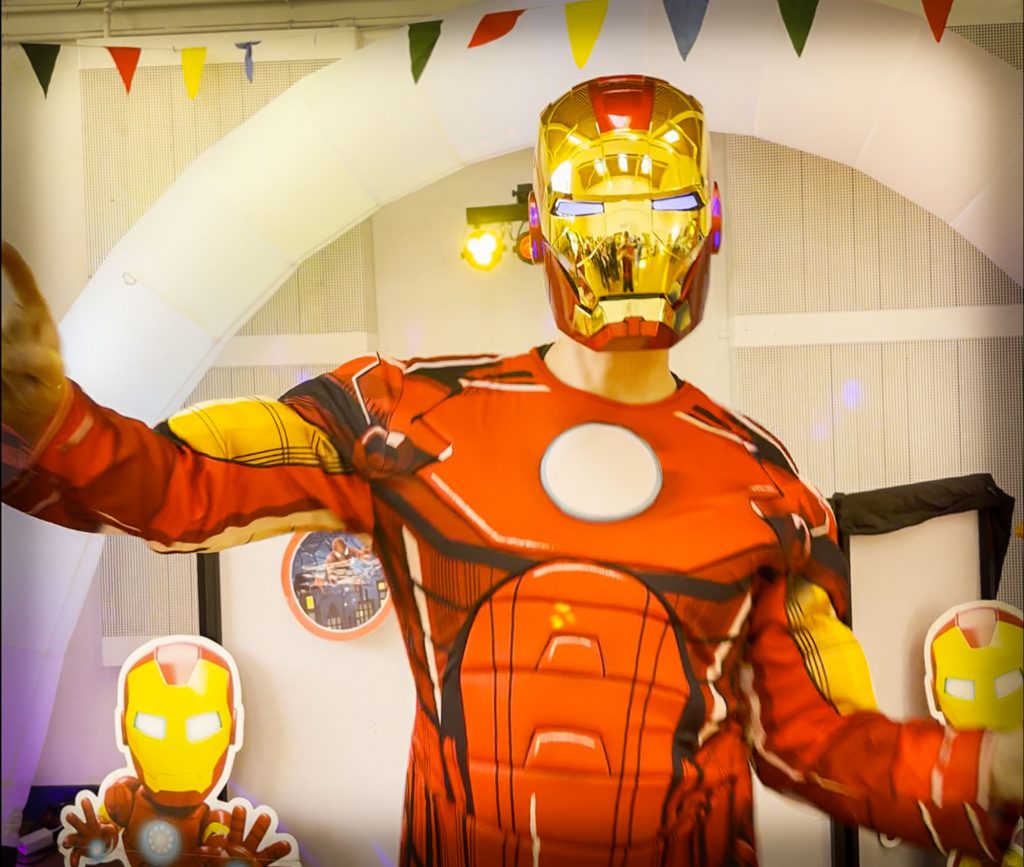 Iron Man entertainer wearing an articulated mask with glowing eyes at a children’s superhero party in Hook near Aldershot and Yateley