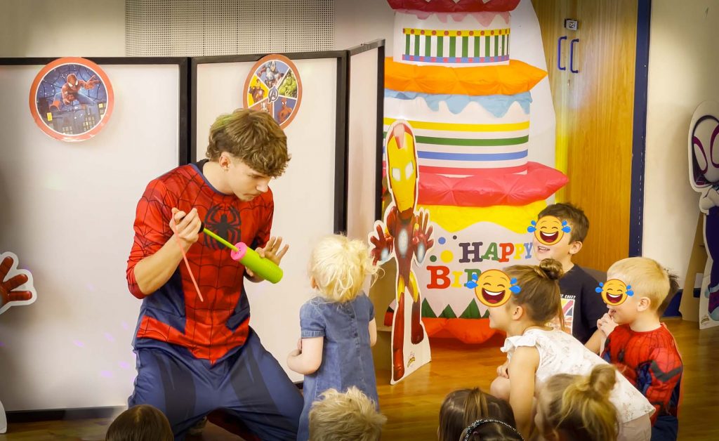 Spider-Man entertainer performing comedy balloon modelling for children at a superhero party in Fleet near Camberley and Farnborough.