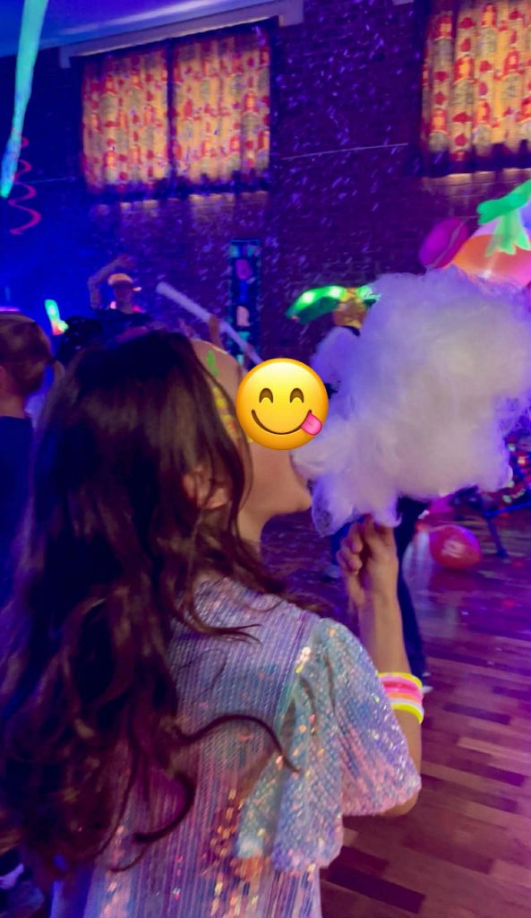 A smiling child enjoying freshly made candy floss at a children’s party in Camberley. A sweet and colourful moment that shows how our candy floss machine adds excitement and joy to birthdays across Farnborough, Fleet, Aldershot, Bracknell and surrounding areas in North Hampshire, West Surrey and South Berkshire.