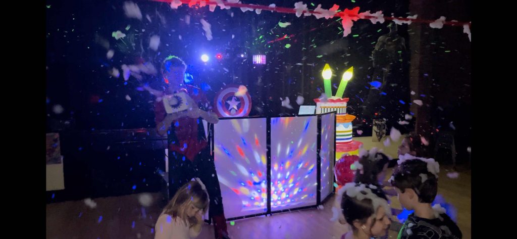 Spiderman themed birthday party setup with decorations and disco equipment in Hampshire