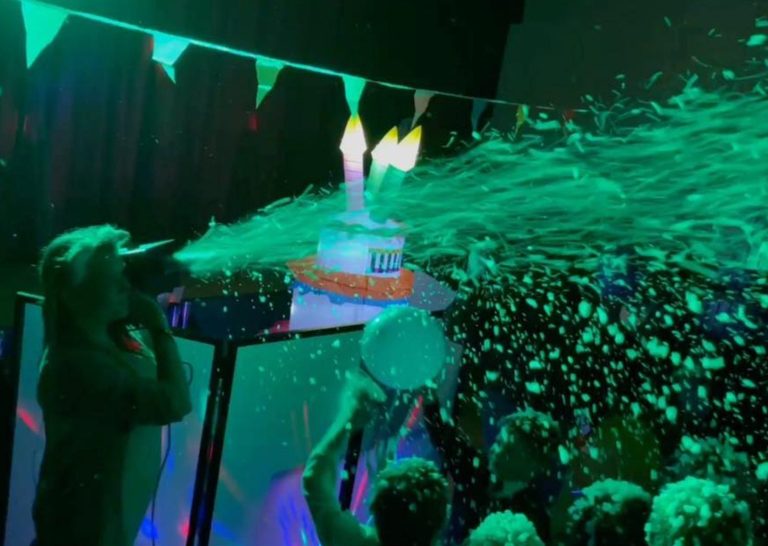 Foam cannon spraying over children on the dance floor