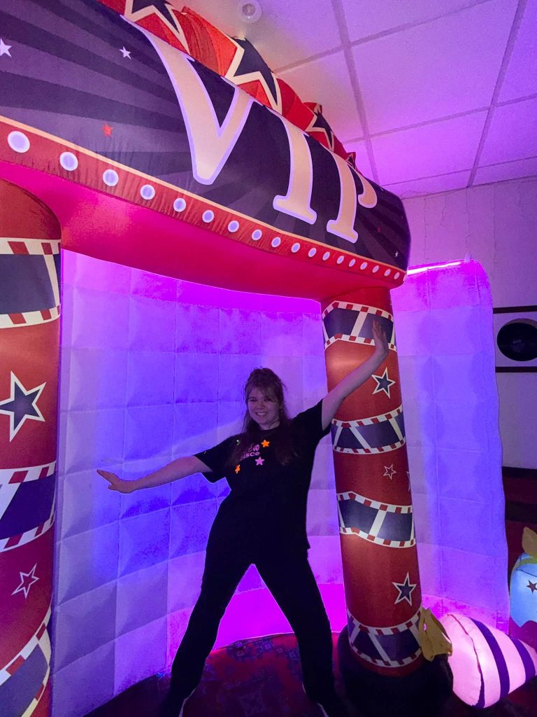 Entertainer in a glowing VIP entrance arch