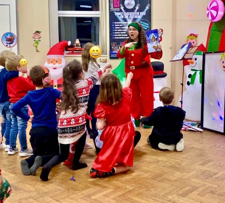 Elf entertainer leading Christmas party games