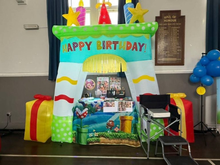 Super Mario themed party arch and gift inflatables