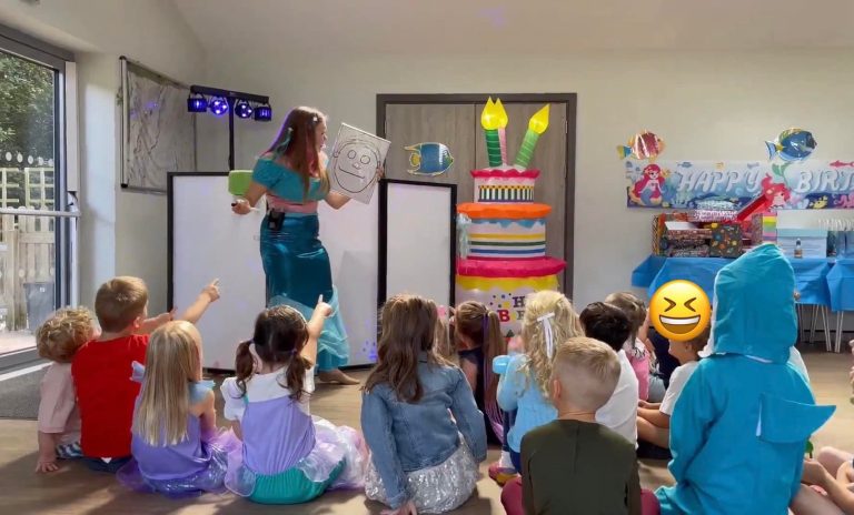 Ariel performing a magic show for seated children