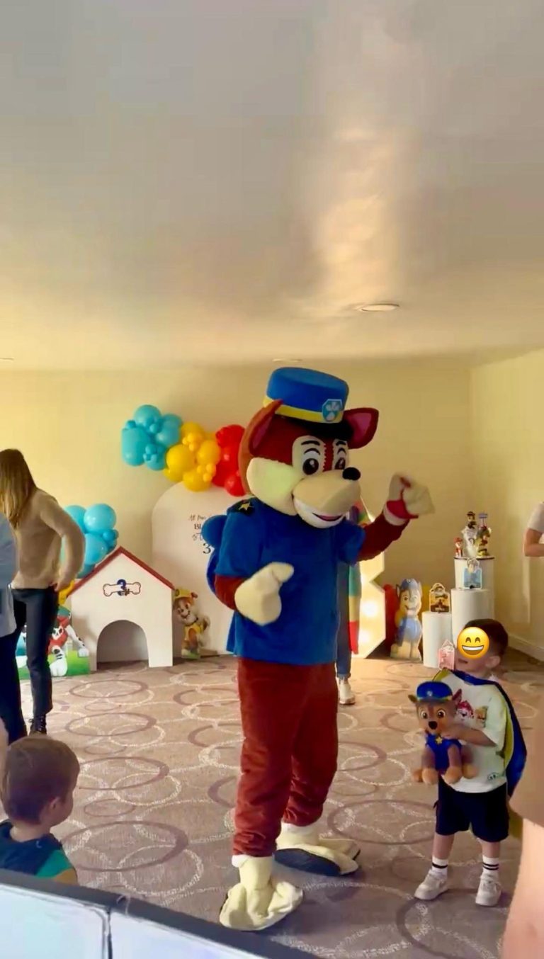 Chase mascot in police uniform at a Paw Patrol party