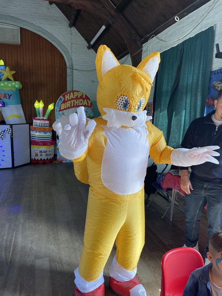Giant Tails mascot at a Sonic party