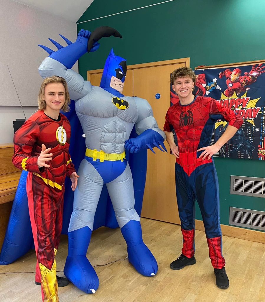 Superhero squad - Treasure Box Parties Spider-Man and The Flash entertainers either side of a giant Batman inflatable